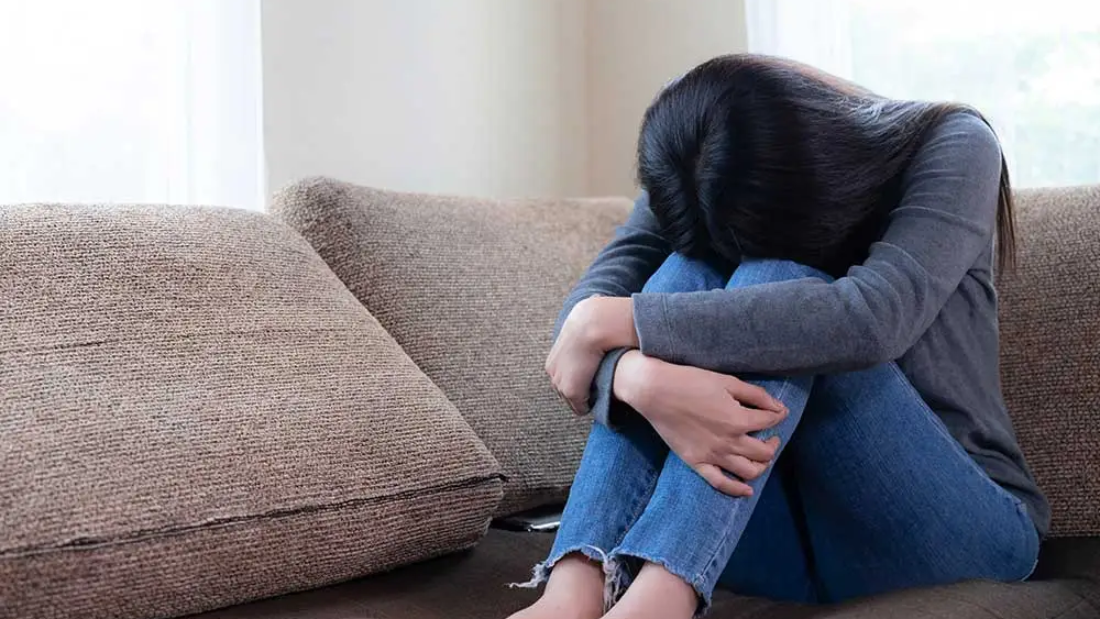 emotional-young-woman-was-depressed-sofa