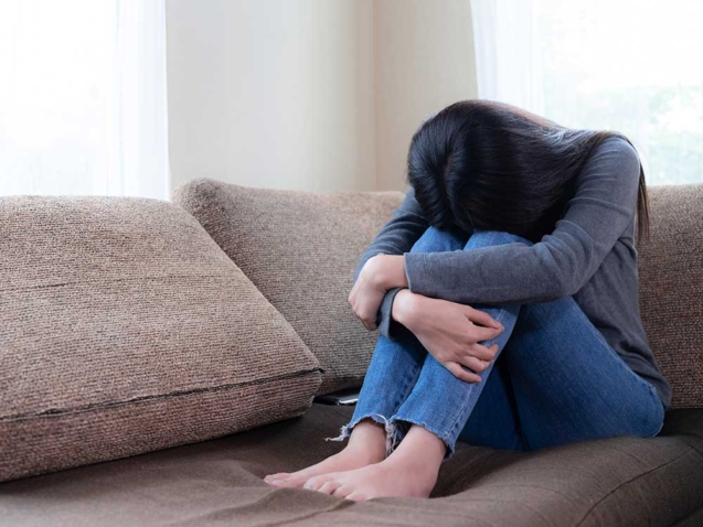 emotional-young-woman-was-depressed-sofa