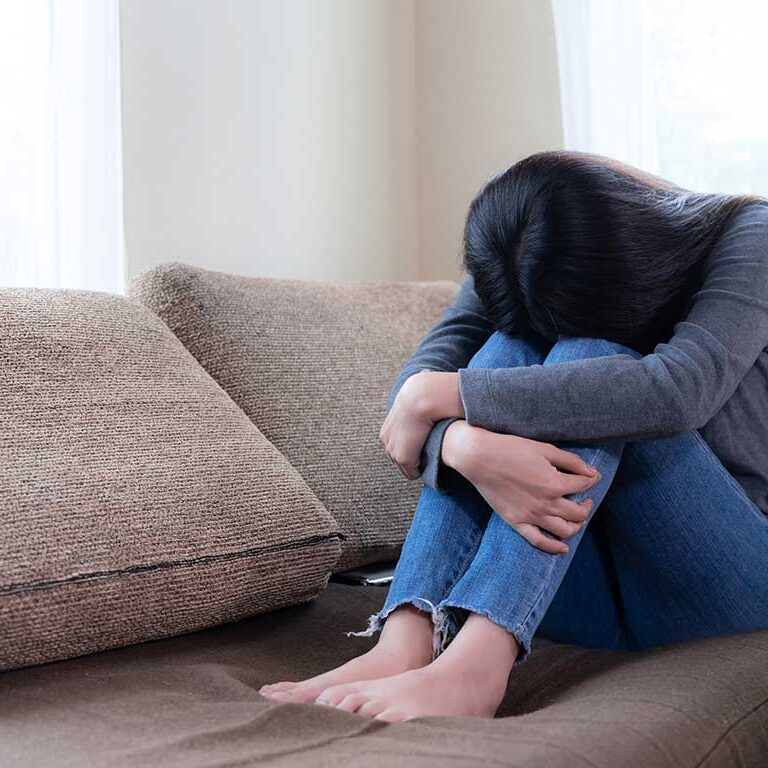 emotional-young-woman-was-depressed-sofa